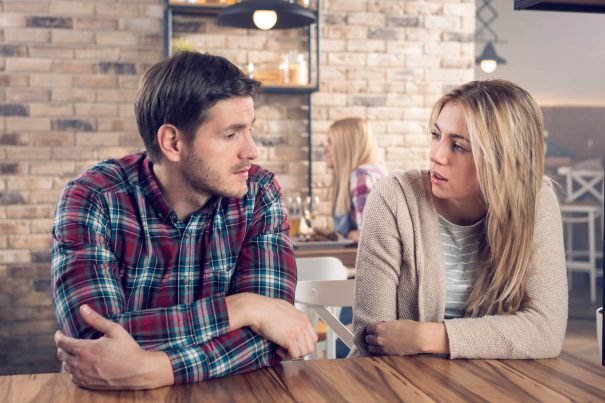 couple talking at table reserved personality