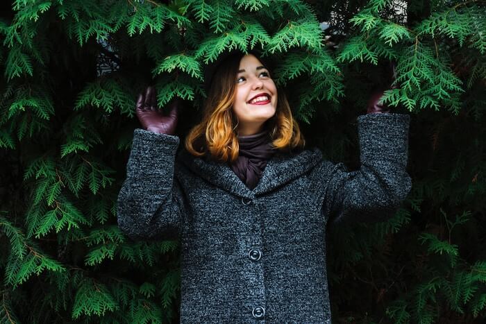 woman outside under tree positive affirmations