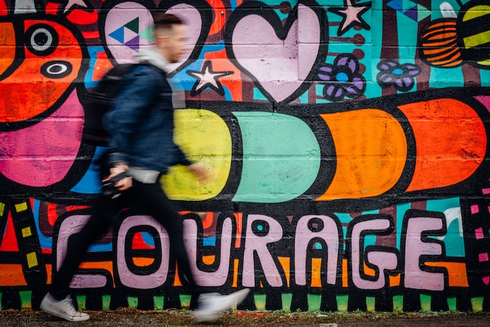 man walking by graffiti Values In Life