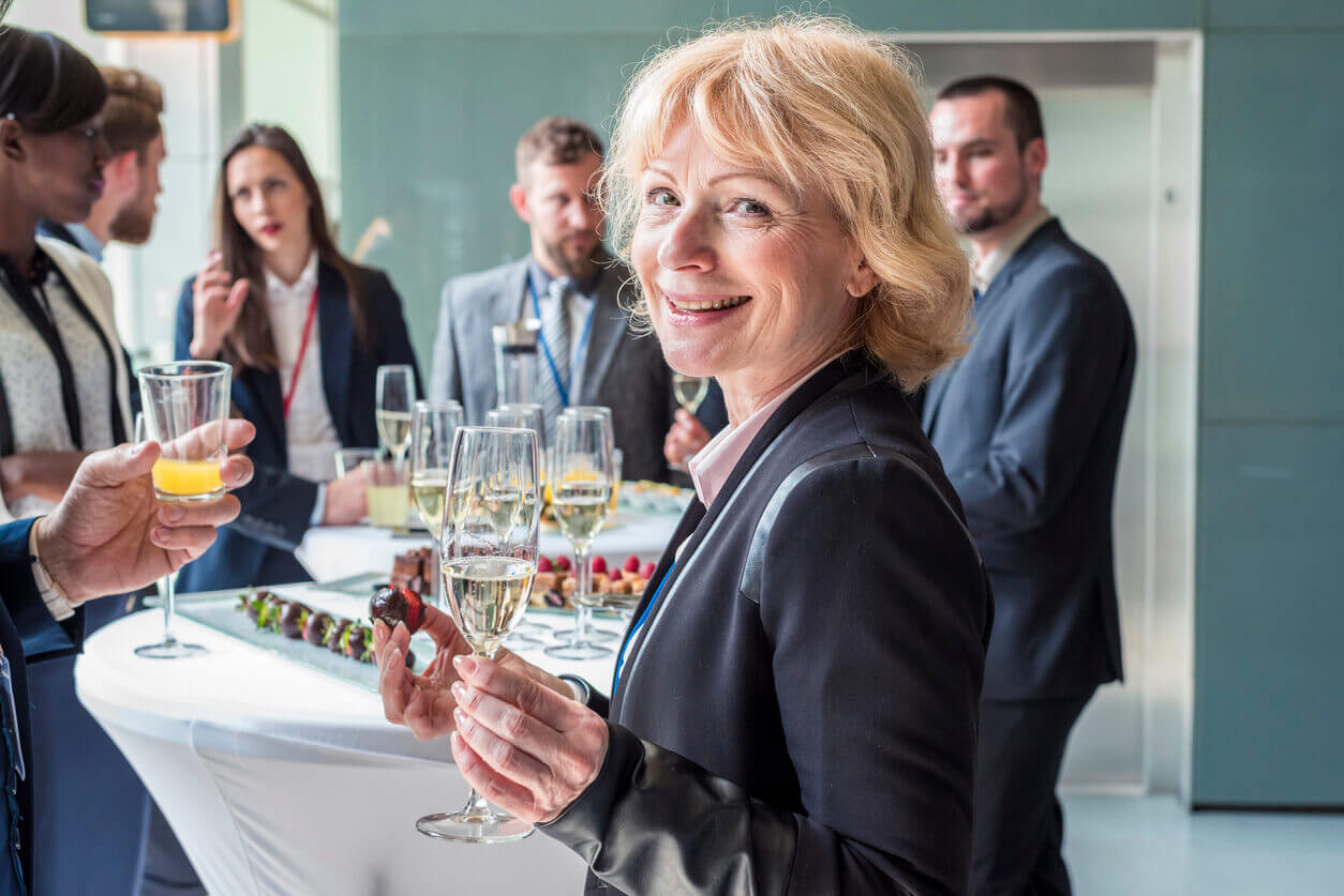 woman at party what to write in a retirement card for a friend