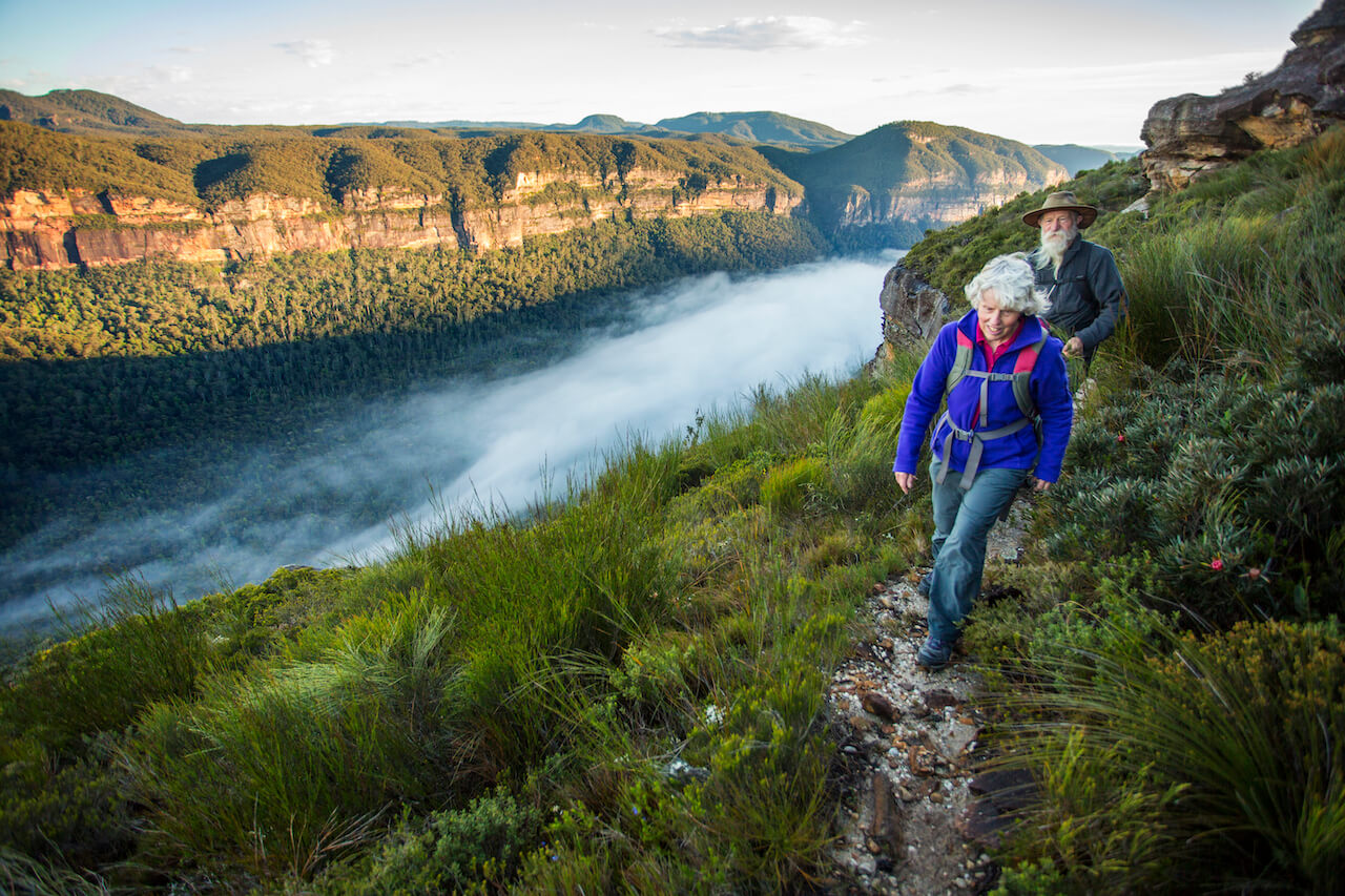 senior walking in the mountains things to do when retired and bored