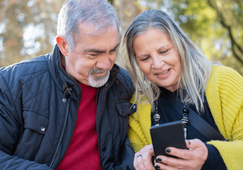 senior couple using the phone together apps for seniors