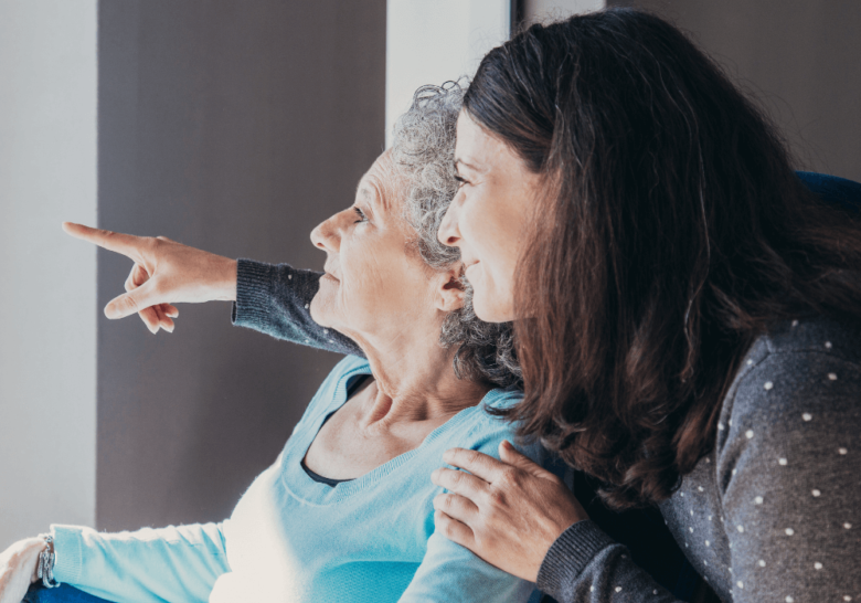 senior parent and daughter looking at something caring for elderly parents quotes
