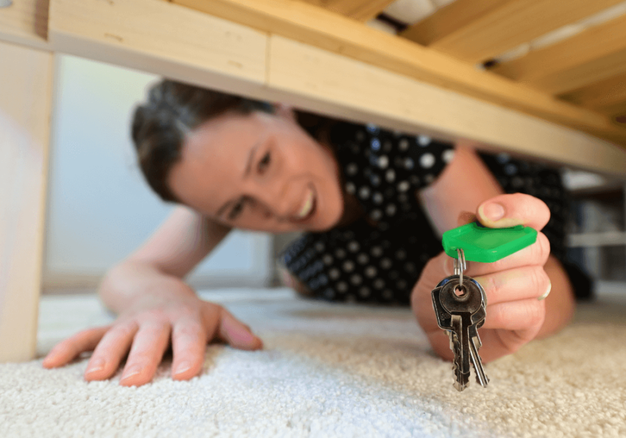 woman looking under the bed How to Find Things You Lost At Home