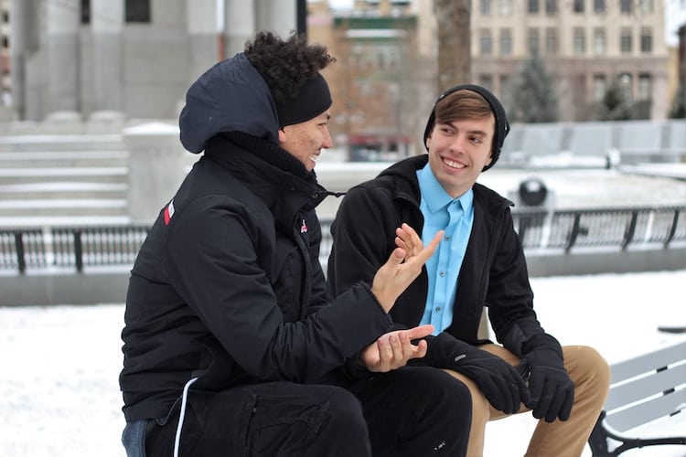 men having conversation outside personal development goals