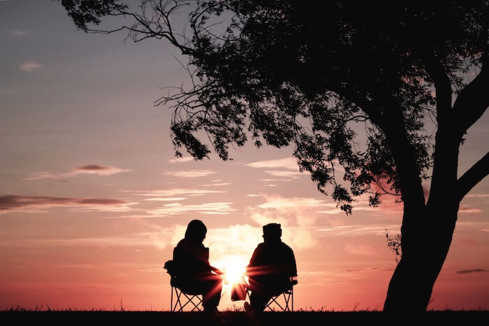 couple watching sunset romantic things to do