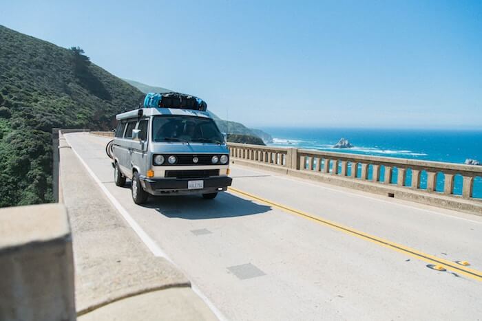 volkswagen camper on highway ocean money quotes