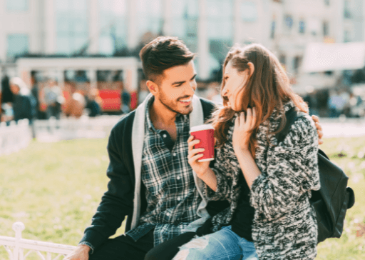 man and woman drinking coffee laughing get to know you questions