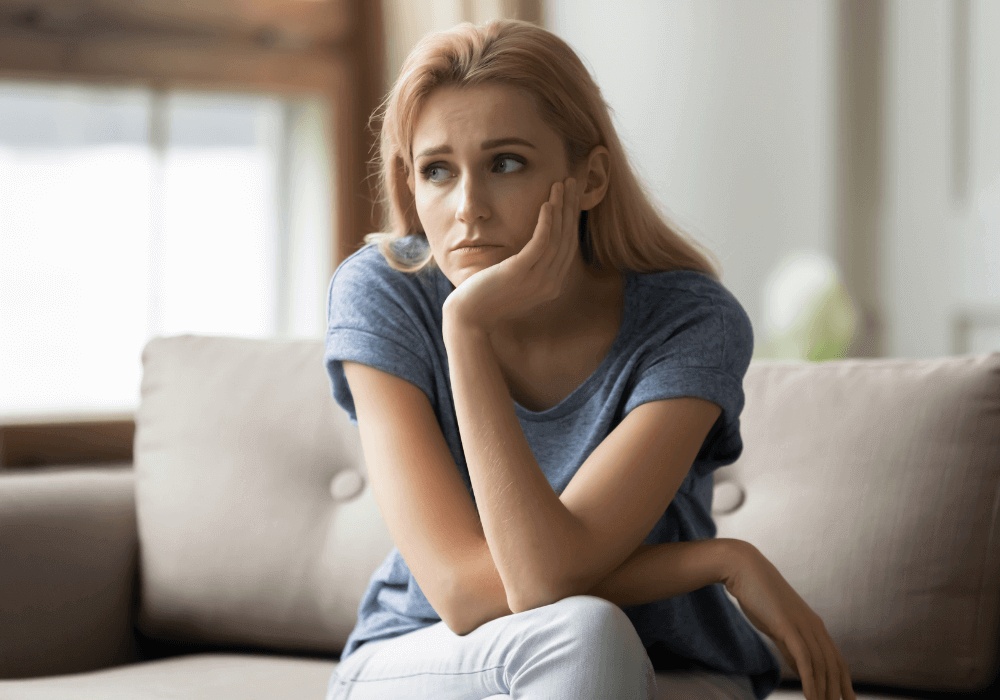 woman sitting on sofa Bitter Person