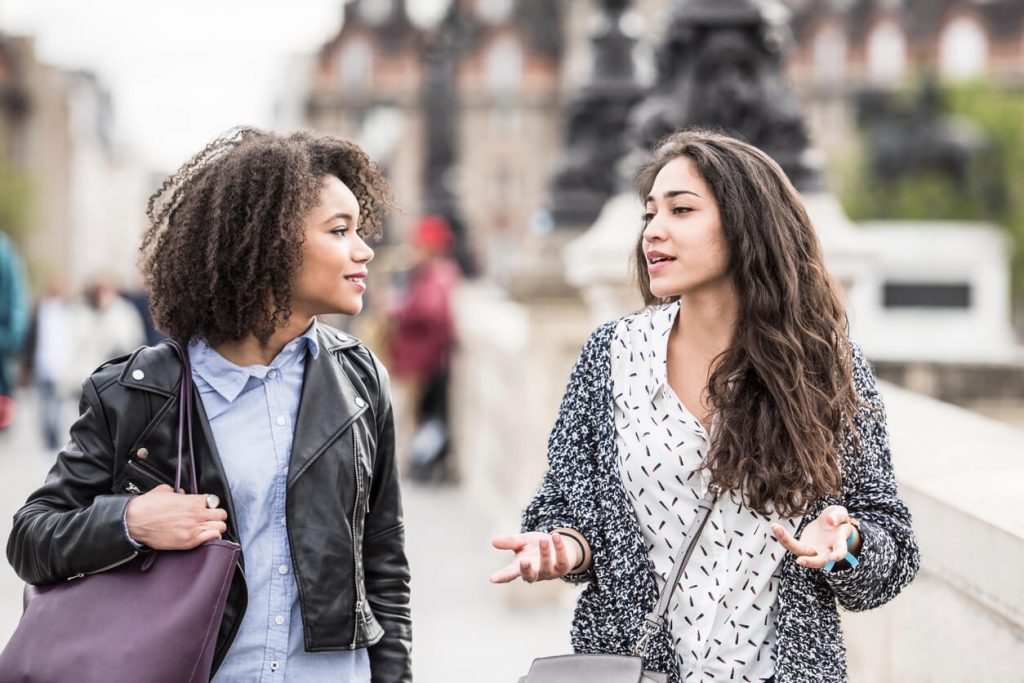 women walking and talking apps to find friends