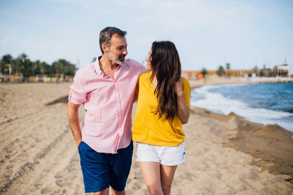 sweet couple walking in the beach what are you looking for in a relationship