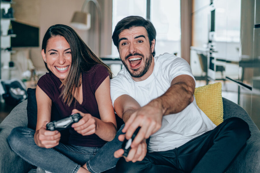 Young couple sitting on the sofa at how to cheer up your girlfriend