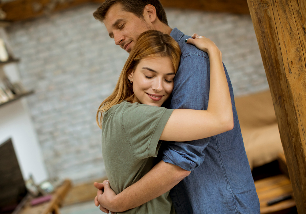 couple hugging sweetly stages of getting back together with an ex