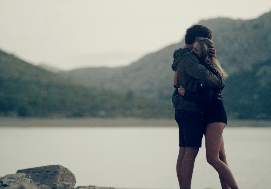 couple hugging by lake signs your ex will eventually come back