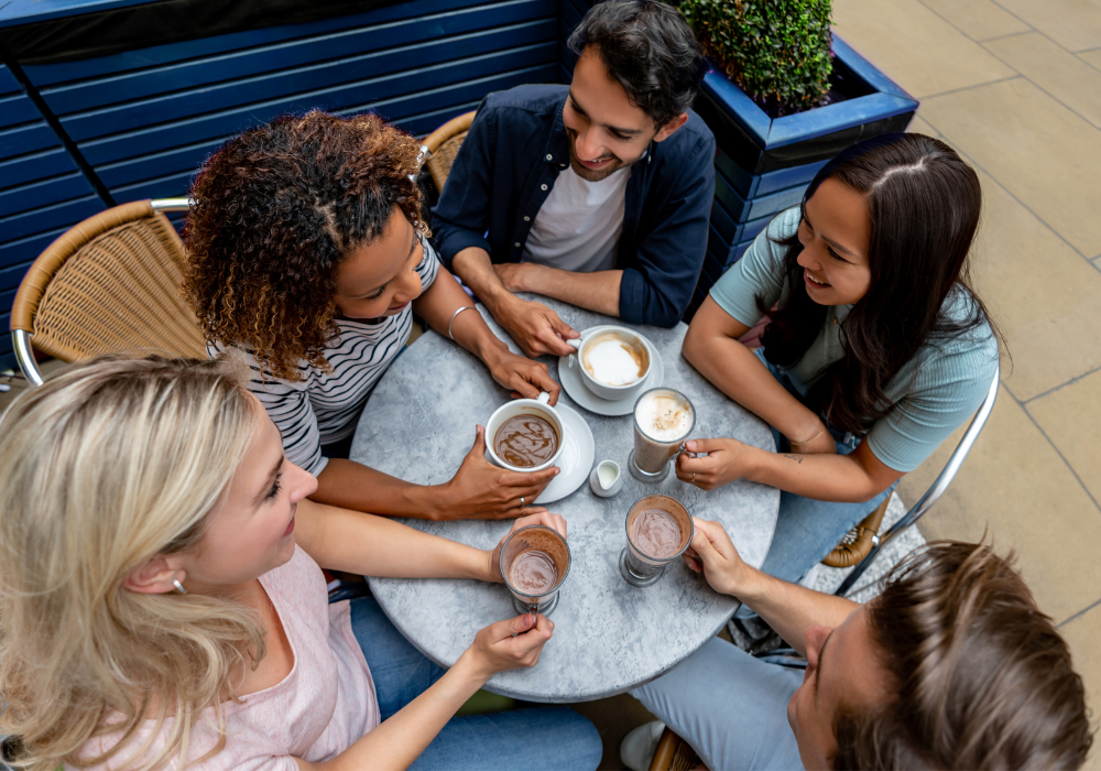 friends having afternoon coffee how to stop interrupting people