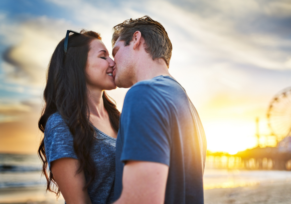 sweet couple kissing what triggers emotional attraction in a man