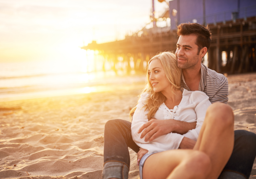 sweet couple in the beach what triggers emotional attraction in a man