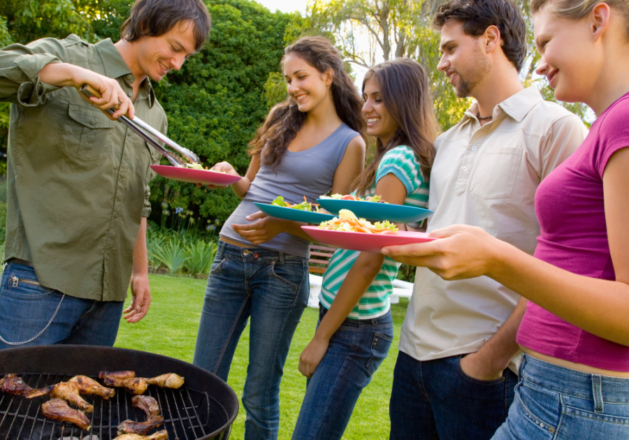 friends enjoying picnic outside things to do on a hot day