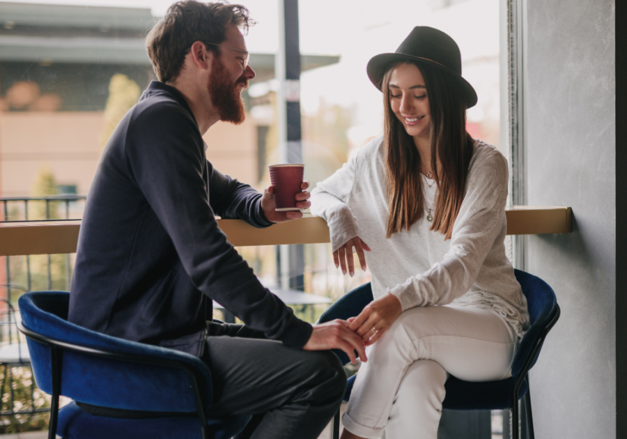 young couple having a coffee date dating vs. relationship