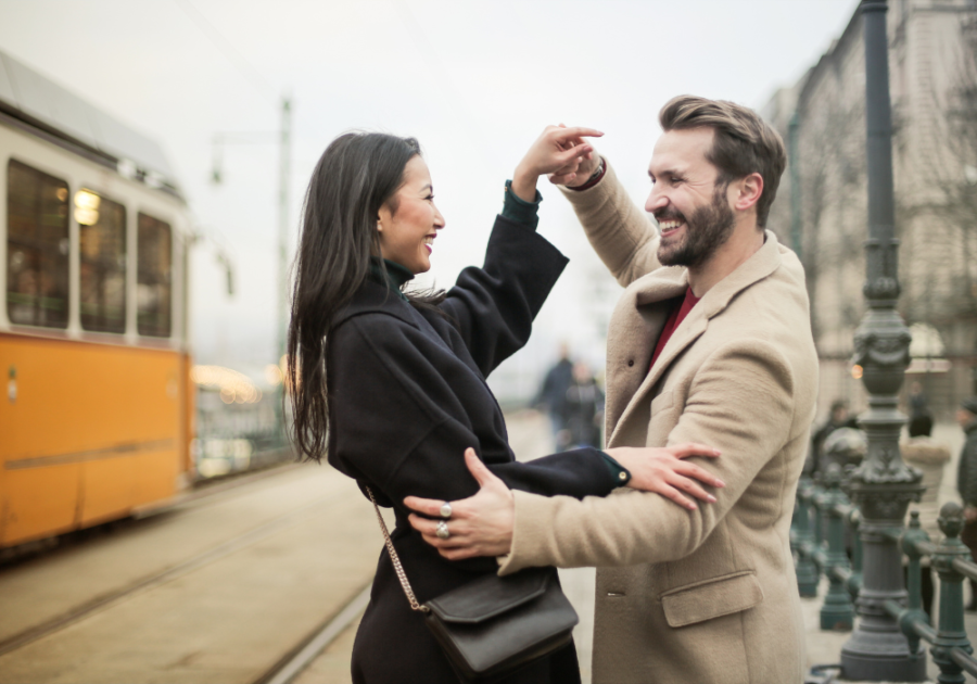 young couple having fun in the street how does a Leo man test a relationship