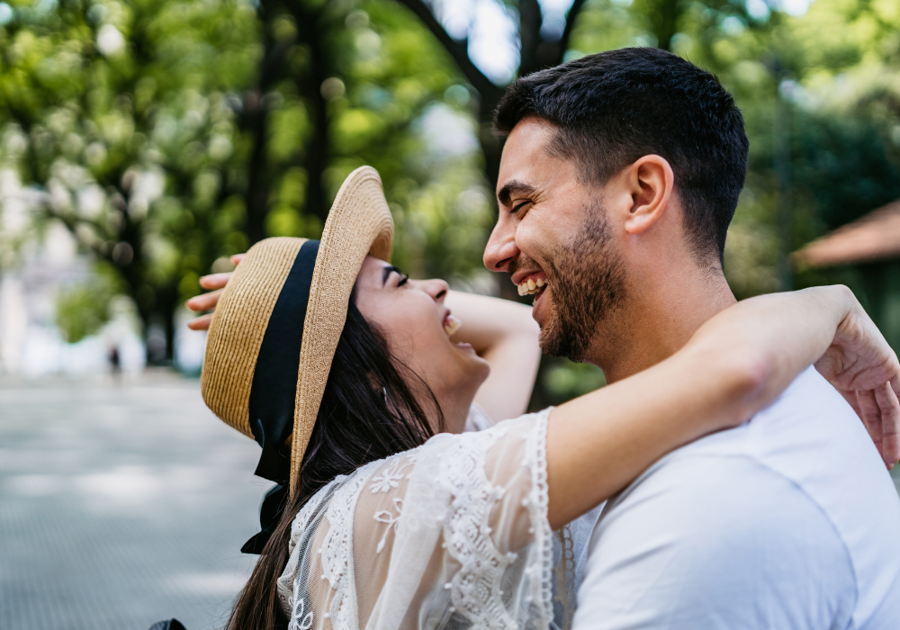 couple sweetly hugging each other how does a Leo man test a relationship