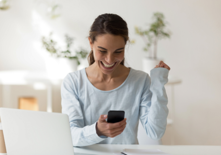 woman smiling while reading phone I miss you texts for her