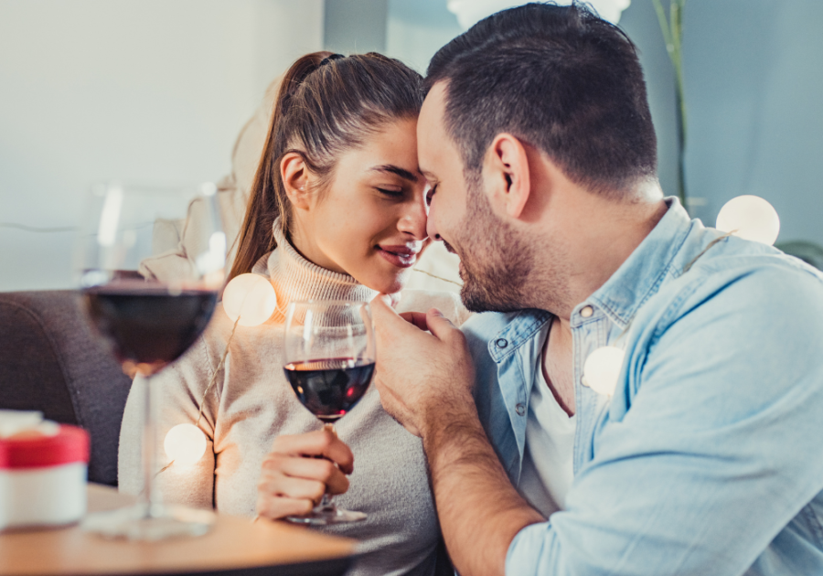 sweet couple having wine night anniversary messages to your boyfriend