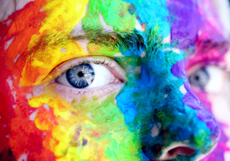 person with face paint What your favorite color says about your personality