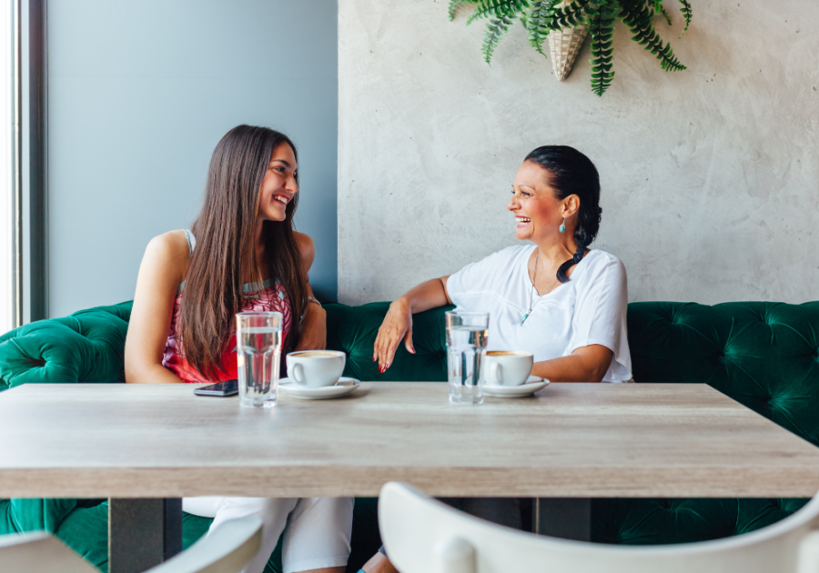 two women having coffee together Beta Female Traits