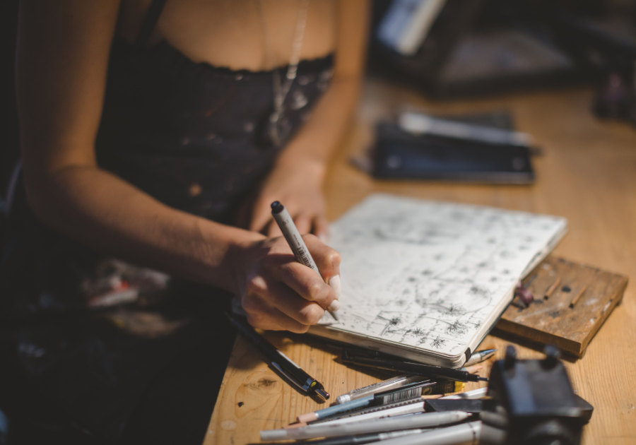 person scribbling in the notebook signs of a heyoka empath