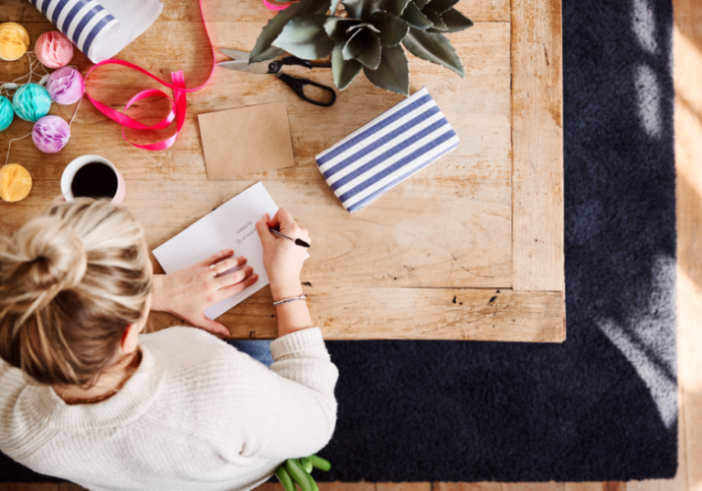 woman in a bun writing a letter emotional birthday wishes for boyfriend