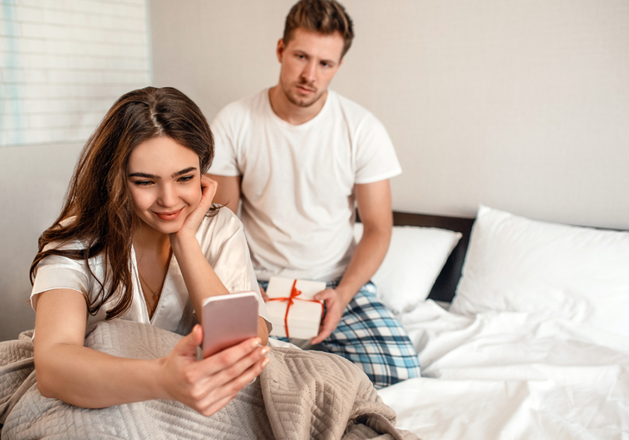 couple in bed she is pretending to love you