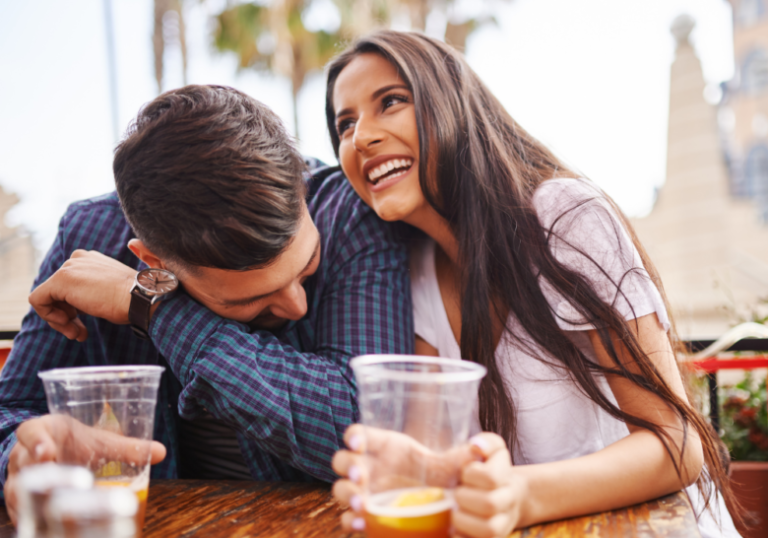 couple having fun while having drinks trick questions to ask your boyfriend