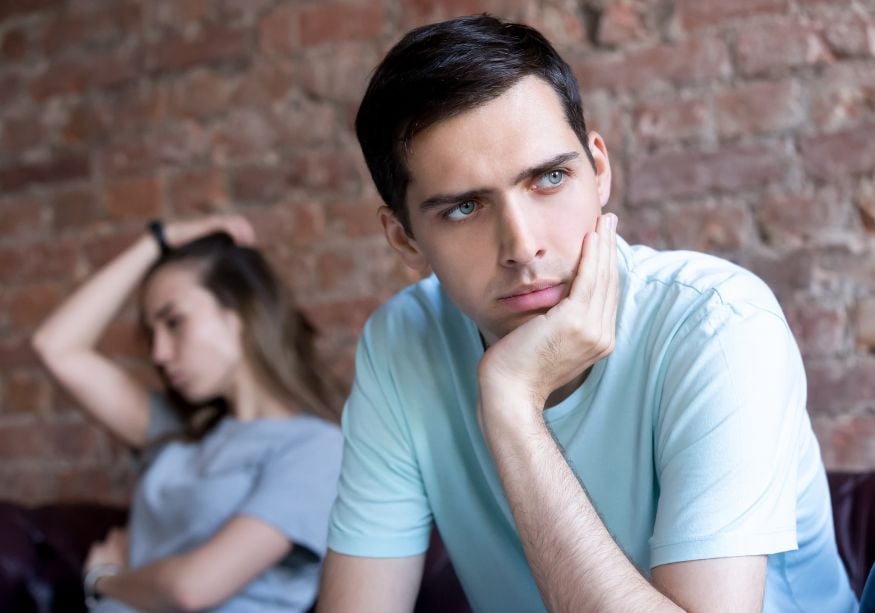 man looking away from woman verbally abusive husband