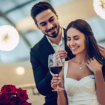 couple drinking standing smiling Couples’ Birthday Ideas