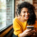 woman smiling on phone Funny Hinge Prompt Answers