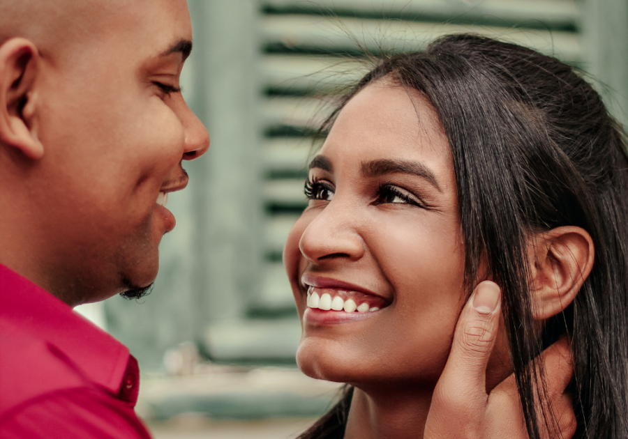 couple smiling close Why His Eyes Dilate When He Looks At You