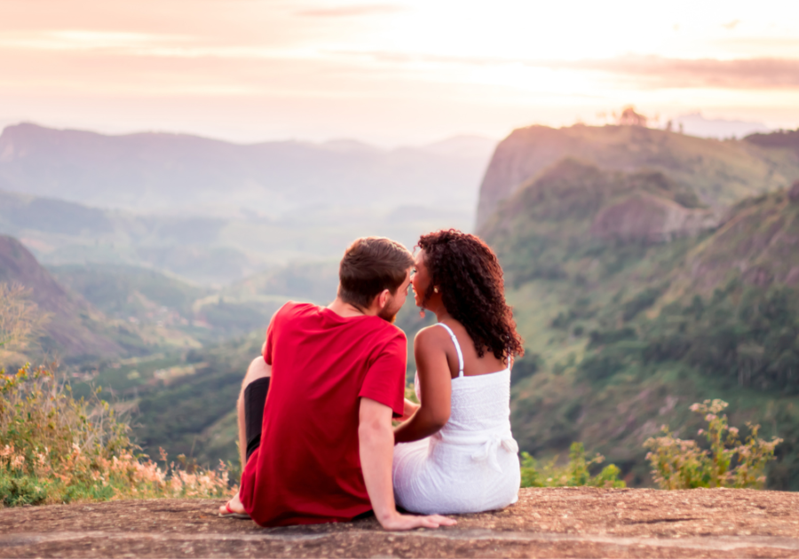 couple sitting on mountainside Open-Ended Questions to Ask a Girl