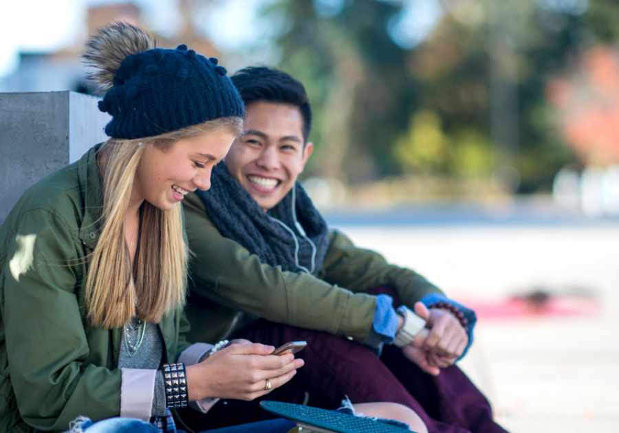 couple sitting together outside in winter Open-Ended Questions to Ask a Girl