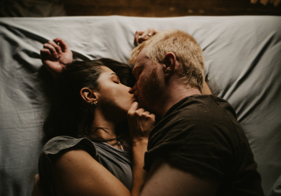 couple kissing in bed how to make your boyfriend obsessed with you