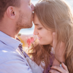 man kissing woman on forehead how to make your boyfriend obsessed with you