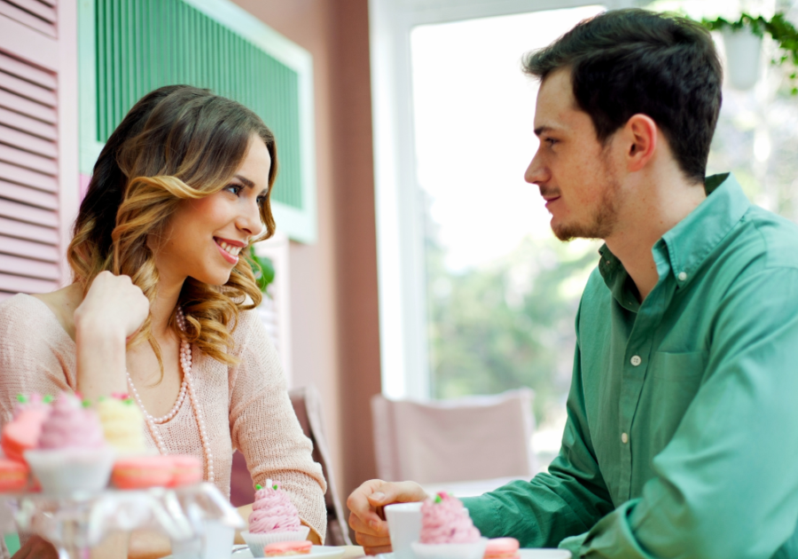 coupe sitting together at table Signs A Woman Is Sexually Attracted To You