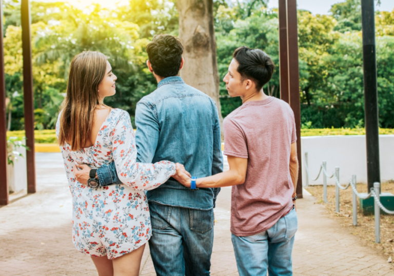 woman and two men hugging Woman Has Multiple Partners