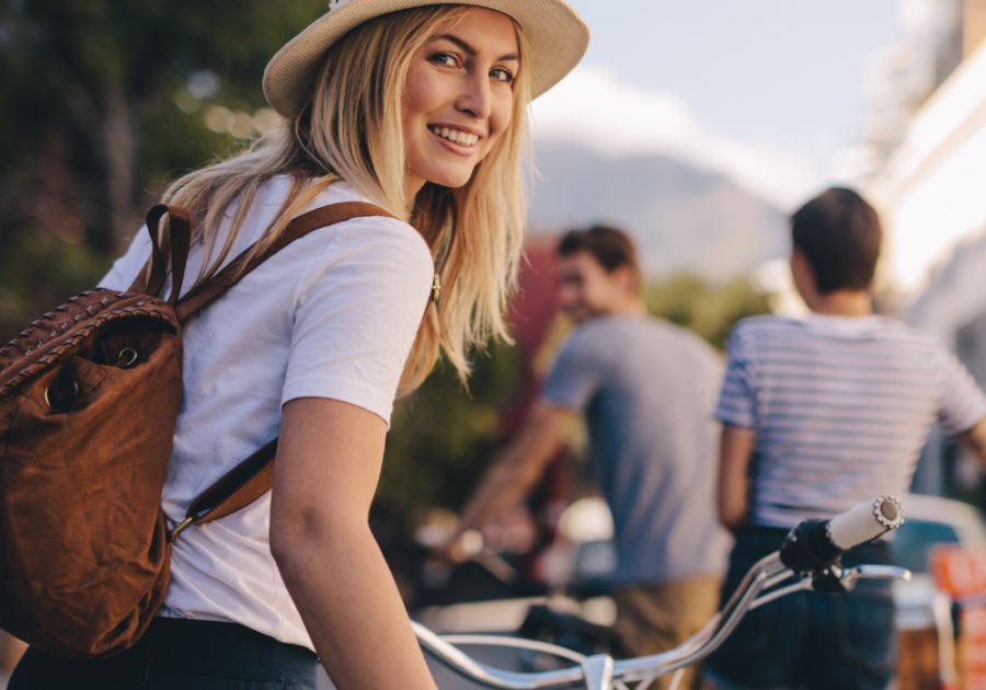 woman happy on bicycle How to Make a Guy Regret Ghosting You