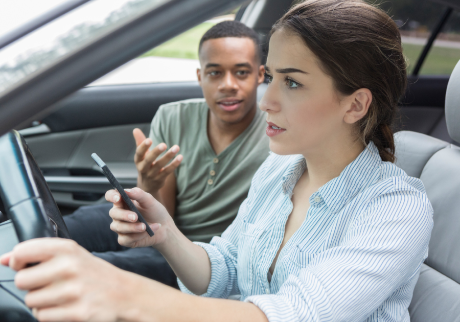 man and woman in car talking ignoring a narcissist