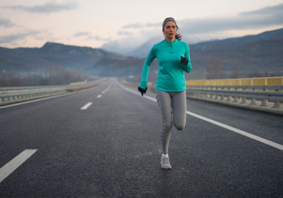 woman running alone on desolate road mental toughness quotes