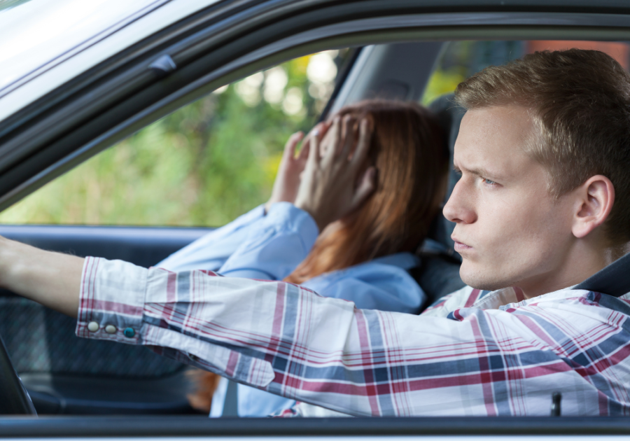 angry man driving car with woman Signs of Anger Issues in Men