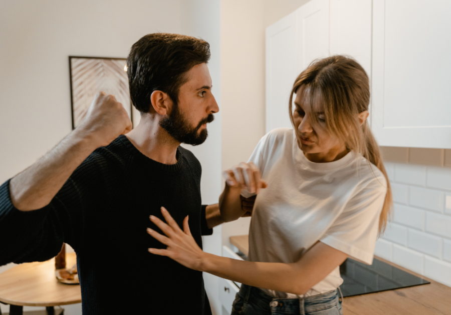 man raising fist toward woman Is it normal for my boyfriend to hit me?