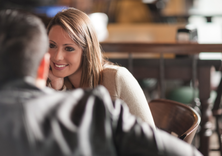 woman staring at man smiling responses to pick up lines