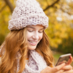 woman outside looking at phone start a conversation on Tinder